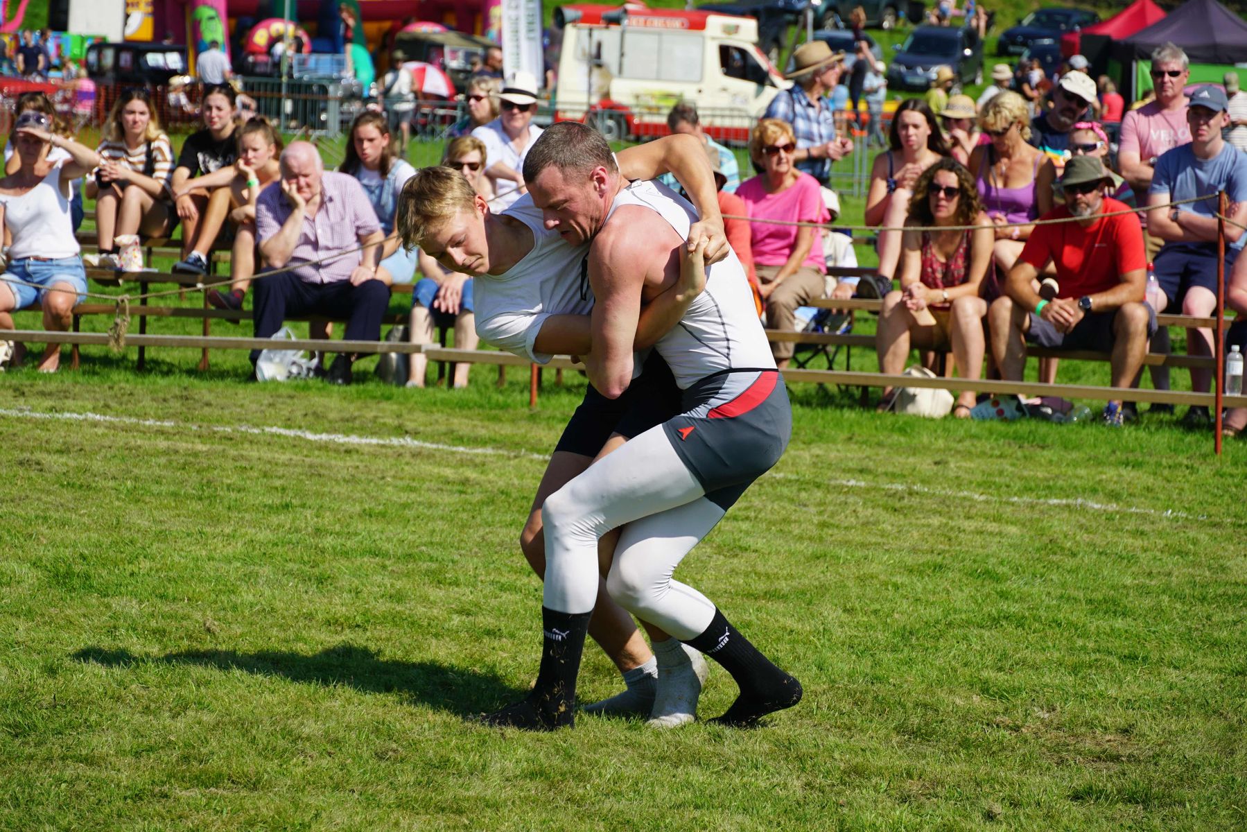 Men compete in the Cumberland & Westmorland wrestling at Grasmere Sports and Lakeland Show