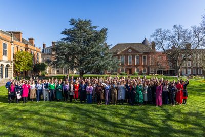 Attendees gather outside Somerville College, University of Oxford for Gardner Leader's International Women's Day event