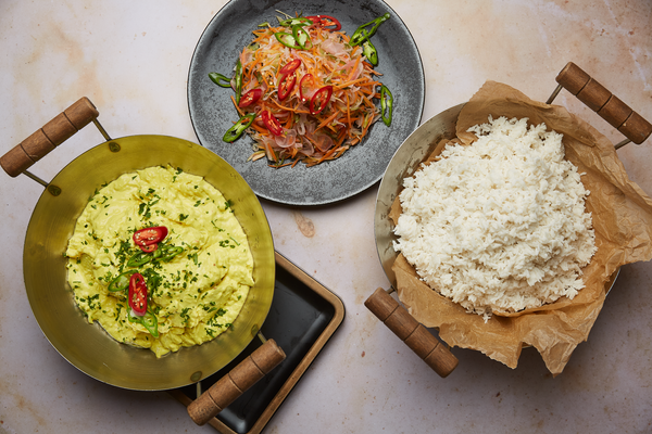 Plant based Malaysian curry, sticky coconut rice,  pickled mooli, carrot, spring onion slaw 