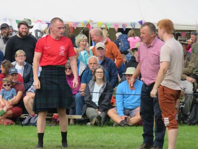 A Scottish competitor in action at Grasmere Lakeland Sports and Show 2023, in the Cumberland and Westmorland wrestling contest.