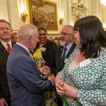 Bryan Baird (centre) meeting HM The King