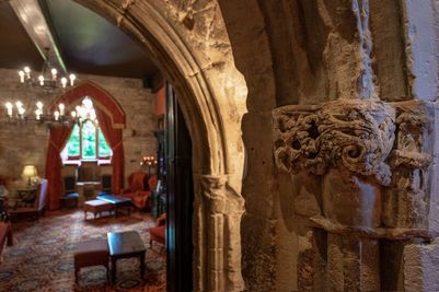 Dramatic archways leading into the Drawing Room at Langley Castle Hotel, Northumberland, UK