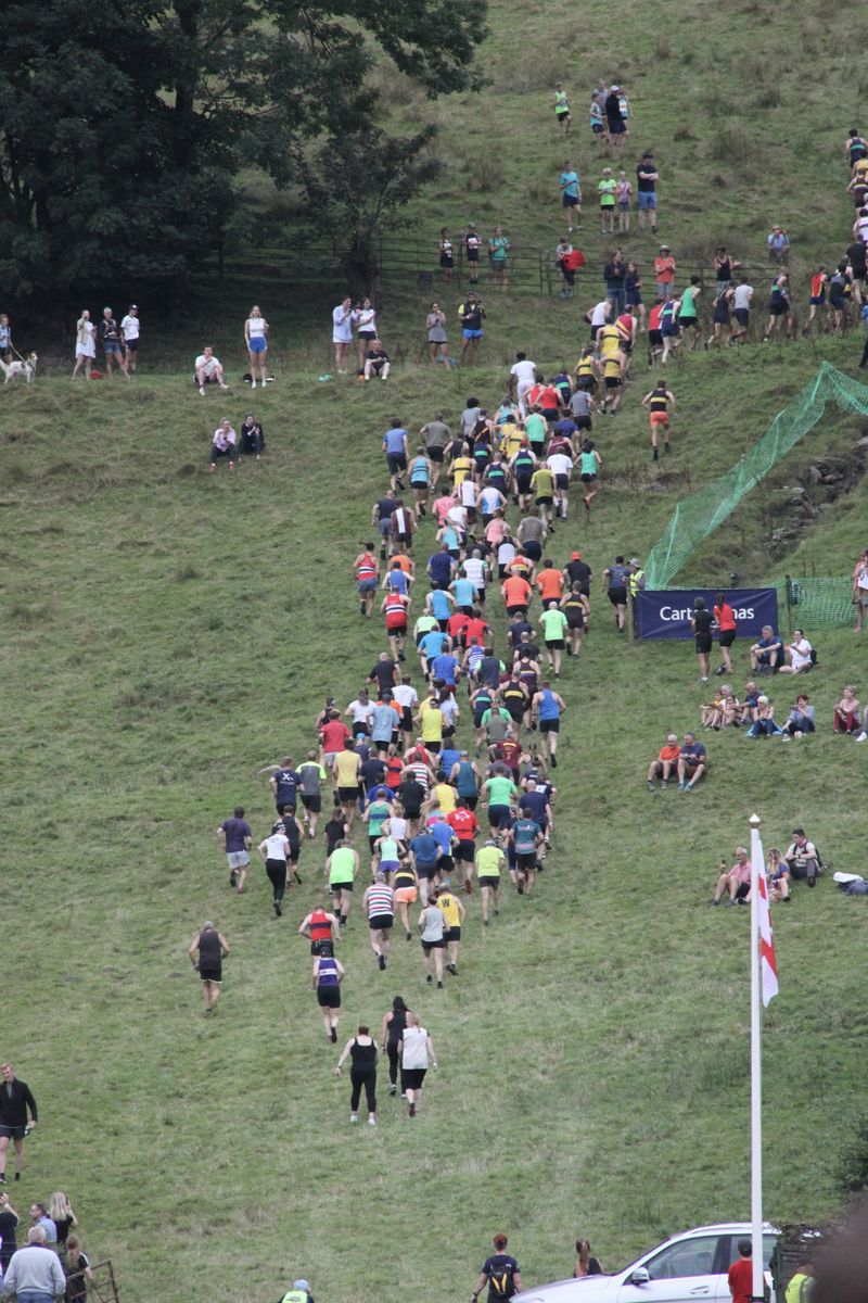 Fell runners head up the fell at the 2022 Grasmere Lakeland Sports and Show