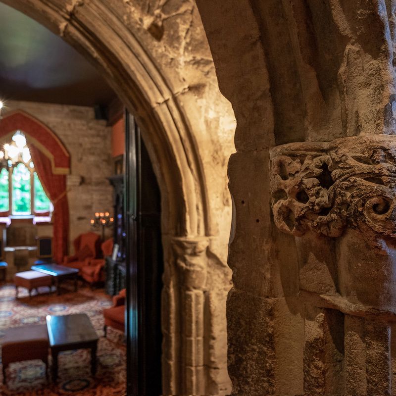 Dramatic archways leading into the Drawing Room at Langley Castle Hotel, Northumberland, UK