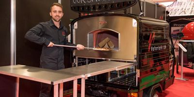 Piaggio Ape FVR UK - a van carrying a Valoriani wood fired pizza oven for mobile caterers