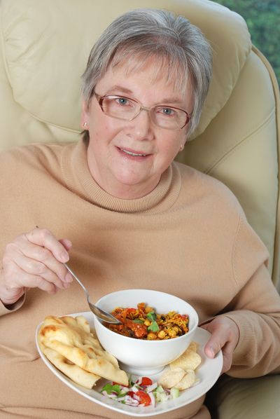 Woman eating a vegetarian meal