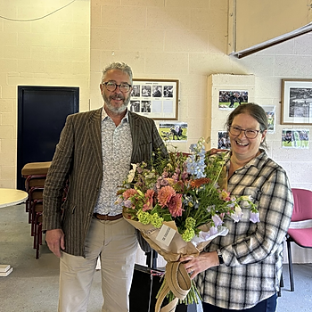 Chairman of Grasmere Lakeland Sports and Show, John Hibbert, presents Deborah Black with a bouquet of flowers.