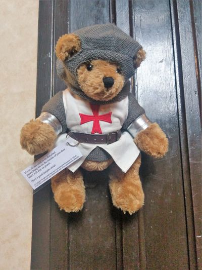 Langley Bear on a doorknob at Langley Castle Hotel, Northumberland, UK. 