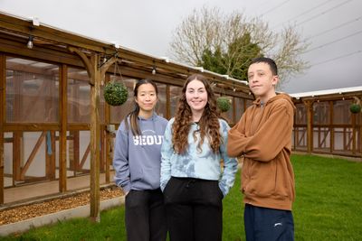 Moulton College students Anna and Lewis with Cloverlea Cattery's Hayley