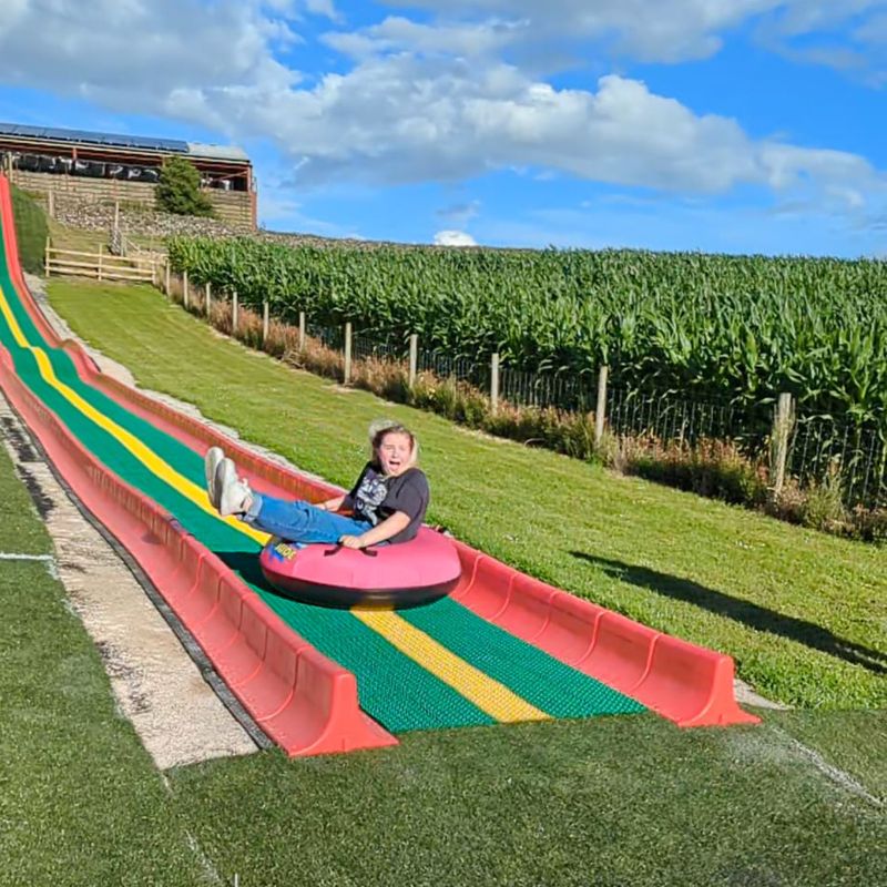 The 150-foot long Super Mega Ride n Slide at the Lakeland Maze Farm Park, Sedgwick near Kendal, the Lake District