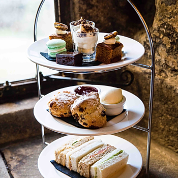 Afternoon tea set into the ancient walls of Langley Castle Hotel, Northumberland