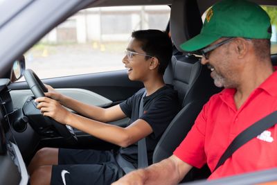 A young person  behind the wheel at a Young Driver event