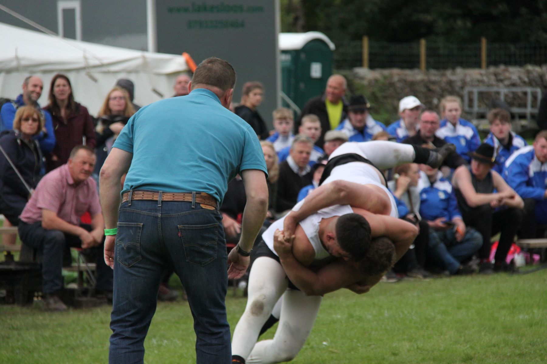 Thomas Gibson performs a winning manoeuvre in the Cumberland and Westmorland wrestling competition at the 2023 Grasmere Lakeland Sports and Show, from which he emerged the World Champion, in the All-Weights division.