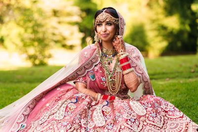 Bride Aashna Jain, on the day of her traditional Indian wedding at Langley Castle, Northumberland, UK, in late August 2024 (credit Mick Merriott Photography)