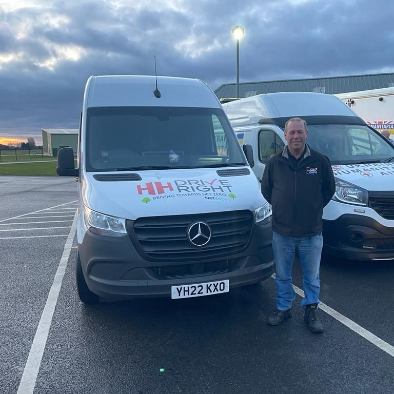 J M Hall employee, Ian Wilson, with the HH Driveright van used for an aid convoy