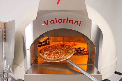 A Fornino 75 wood or gas-fired pizza oven, in cream, from Valoriani UK