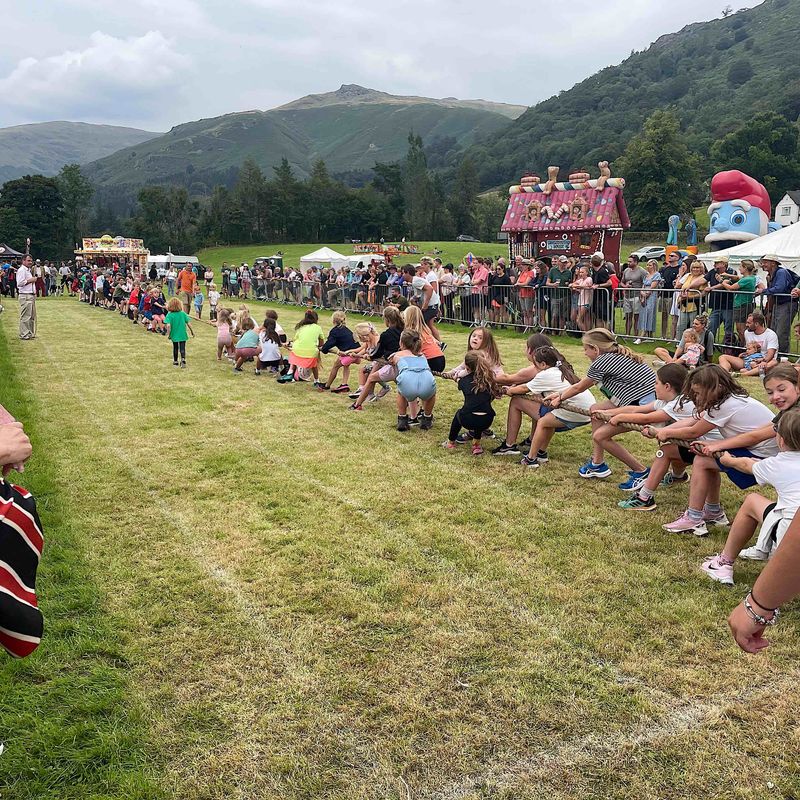 A fun children's tug of war taking place at Grasmere Lakeland Sports and Show