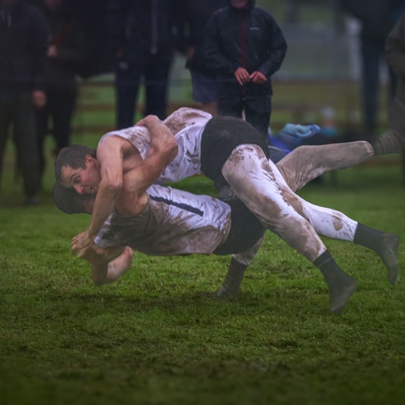 Cumberland and Westmorland wrestlers tackle the muddy conditions at the Grasmere Lakeland Sports and Show 2024.