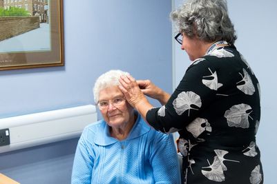 Volunteer Mary Anne Caruana with a visitor to the Bridgnorth Hearing Loss Hub.jpg