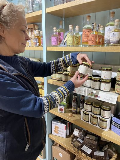 A shopper examines new Morocco Ale Chutney at Levens Hall and Gardens' shop .