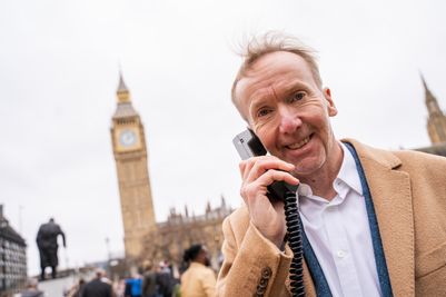 Michael Harrison, speaking on the Vodafone VT1 handset, recreating his iconic first UK mobile phone call 40 years on.jpg