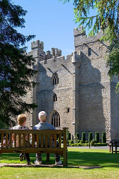 Couple on bench in the Langley Castle grounds