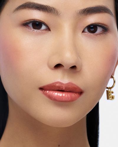 DG_MU25_ORANGE_OIL_LIP_PLUMPER_8056669926283_APPLIED_PRODUCT_JPG_4X5_300DPI.jpg