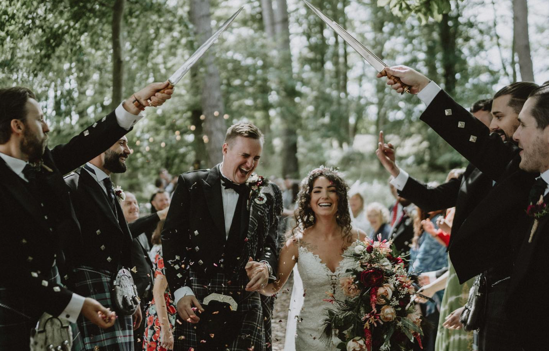 Couple Pippa-Rosy and Chris Parkes, marrying in the woodland wedding grove at Langley Castle, Northumberland, in July 2023.