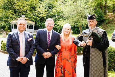 Celebrating 40 years of Langley Castle as a hotel and restaurant L to R: Mohamed Serag (general manager), the Baron and Baroness of Langley (Dr Stuart and Dr Mariann Madnick) and Northumbrian piper, Paul Martin.