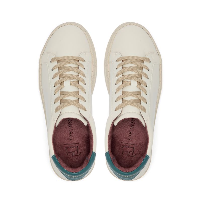 Plant-powered 'Kew' vegan trainer from Cocorose London, in white with Marine Blue heel tab,