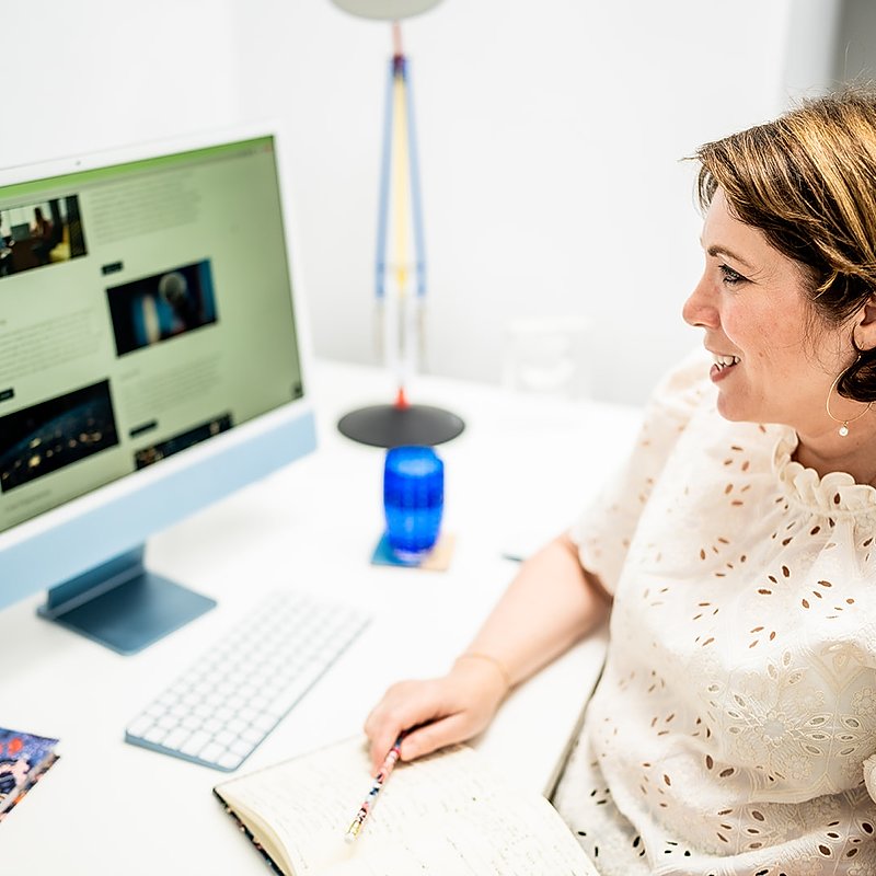 Jane Griffin, Positive Story PR Consultancy sitting at her desk