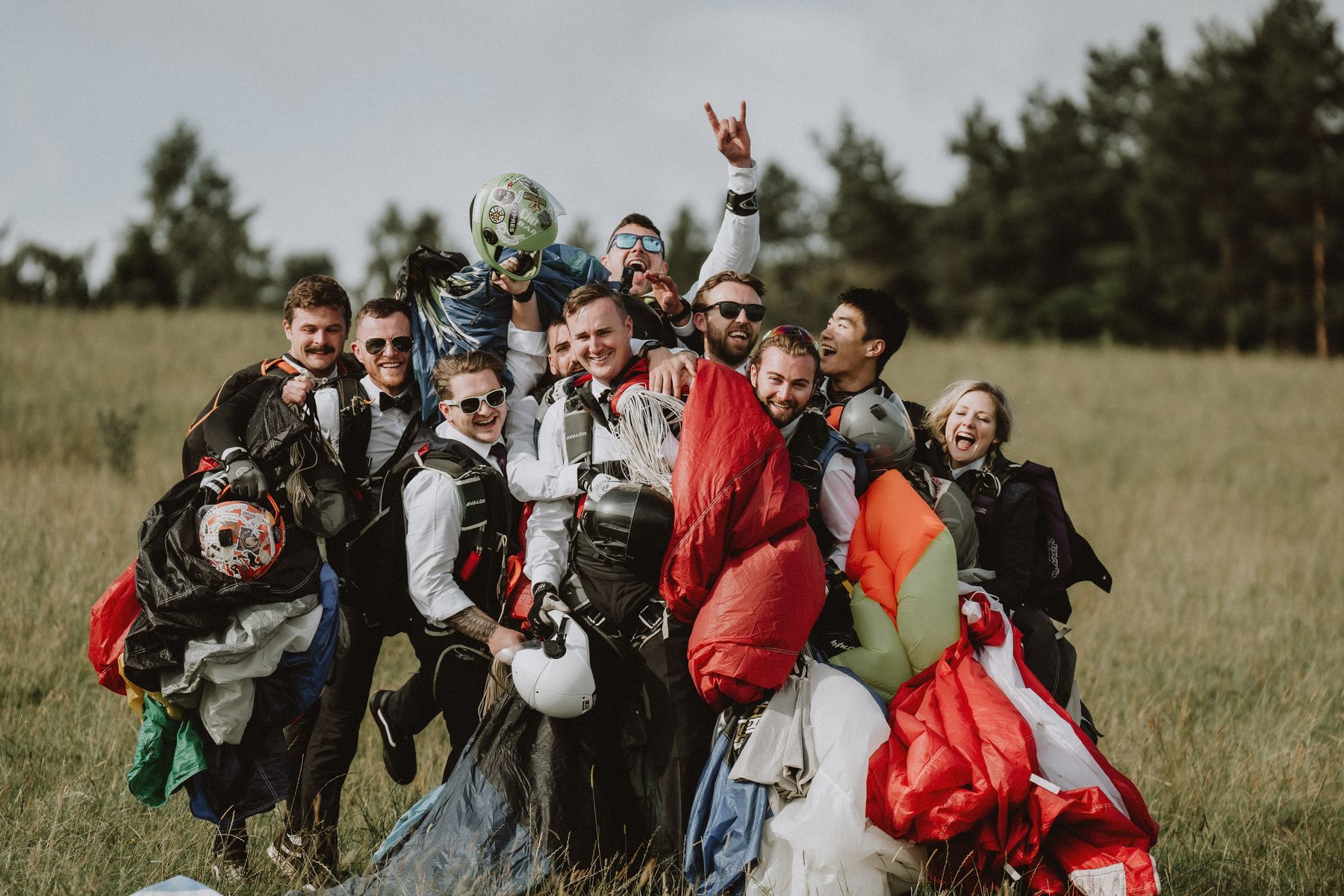 Chris Parkes (centre) with his groomsmen, after all had parachuted into his wedding at Langley Castle Hotel (July 2023)