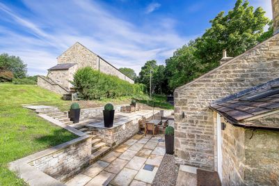 Exterior and private, secluded terrace of Toll Bar Luxury Villa at Langley Castle, Northumberland, UK