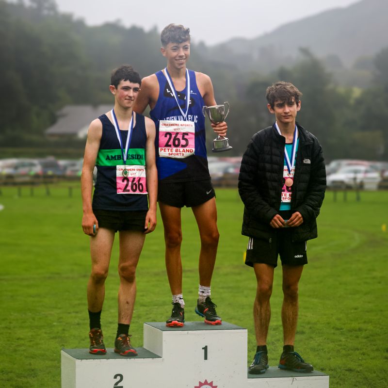 Zeke Sumner (left) on the podium for the Under-17s race at Grasmere Lakeland Sports and Show 2024