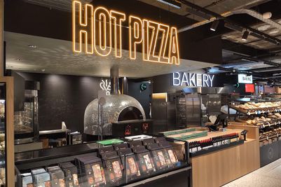 A commercial wood fired Valoriani pizza oven, supplied by Orchard Ovens, in a fast food retail environment/takeaway operation.