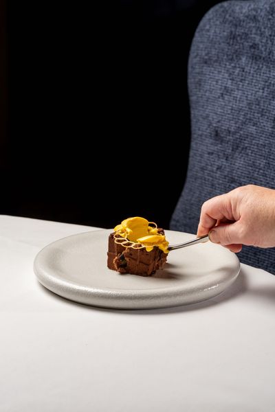 Medieval Langley Castle falls after 676 years - but only in the form of the Dark Chocolate Castle dessert, created as a replica of the castle located in Northumberland, UK, in chocolate mousse.  The dish is the creation of Langley Castle's Culinary Director, Mark Greenaway.