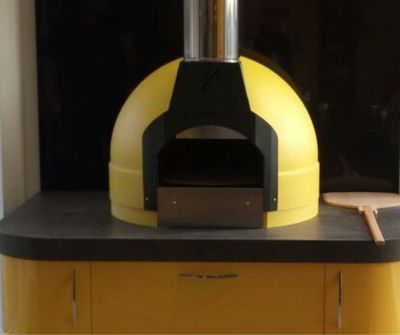 Cucina - the indoor version of the Fornino 60 oven - in an indoor kitchen setting.