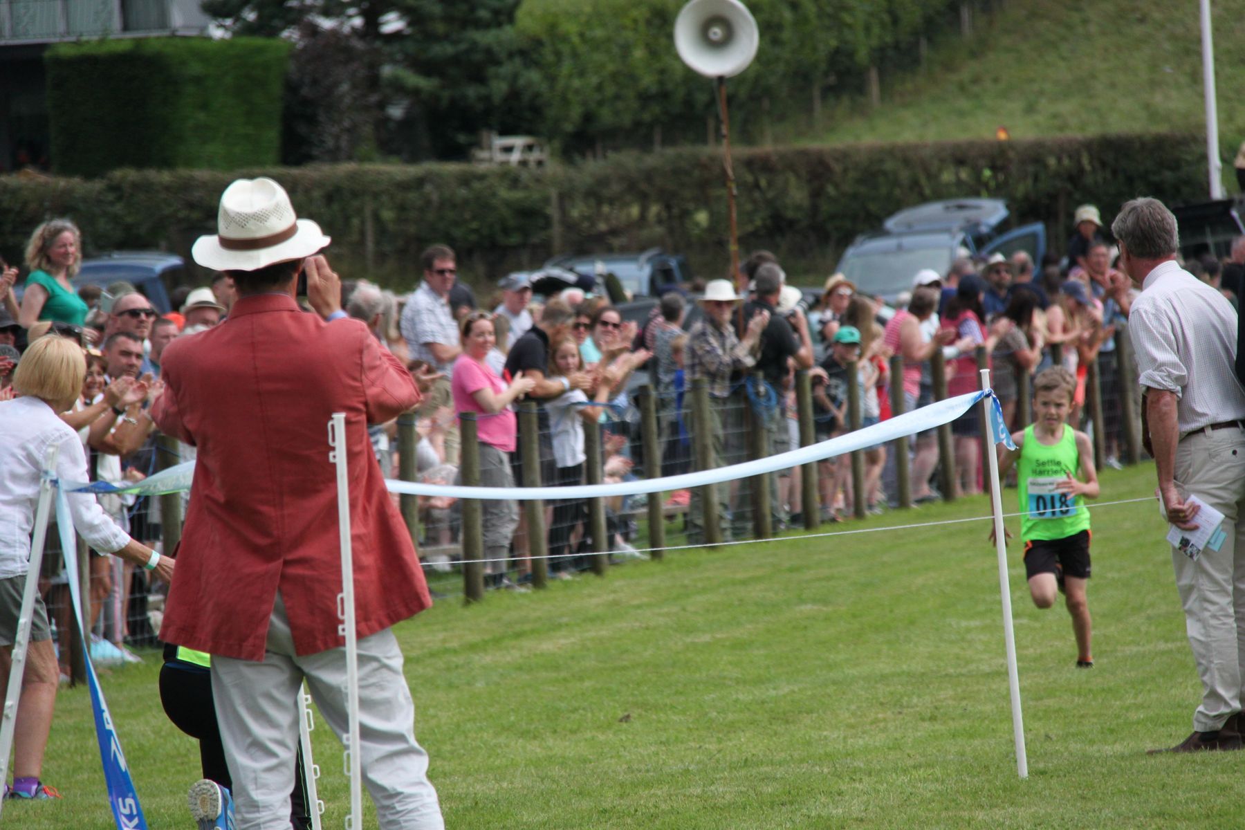 A young fell runner heading to the finish line at Grasmere Lakeland Sports and Show 2022