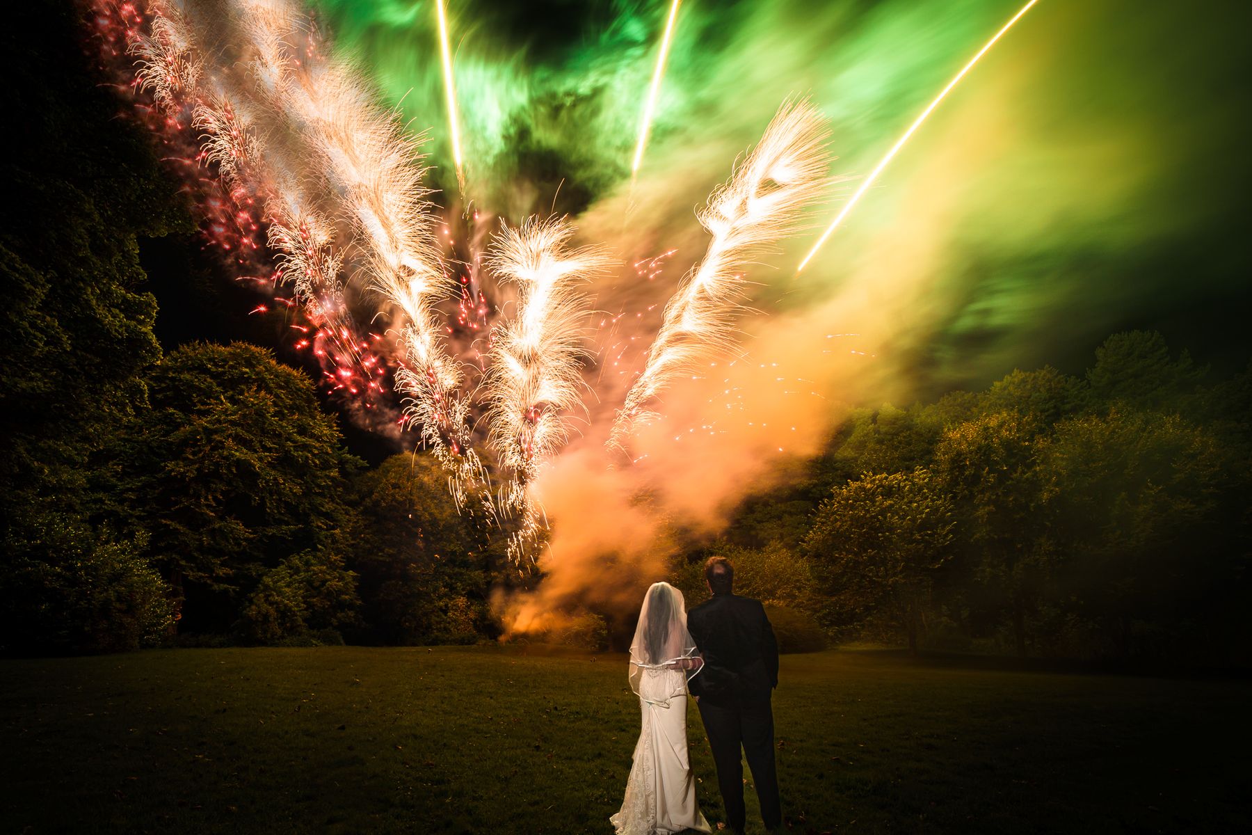 Aashna Jain and Matthew Ronald enjoy a firework display during their traditional Indian wedding at Langley Castle, (Photo credit Mick Merriott)