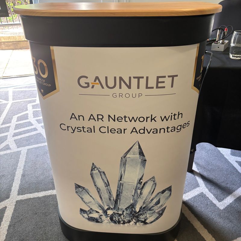 Podium celebrating 15 years of the Gauntlet Appointed Representative Network, at the 2024 annual AR Conference.