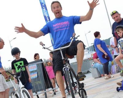 Man riding one of the fun and whacky bikes from Wonder Wheelers