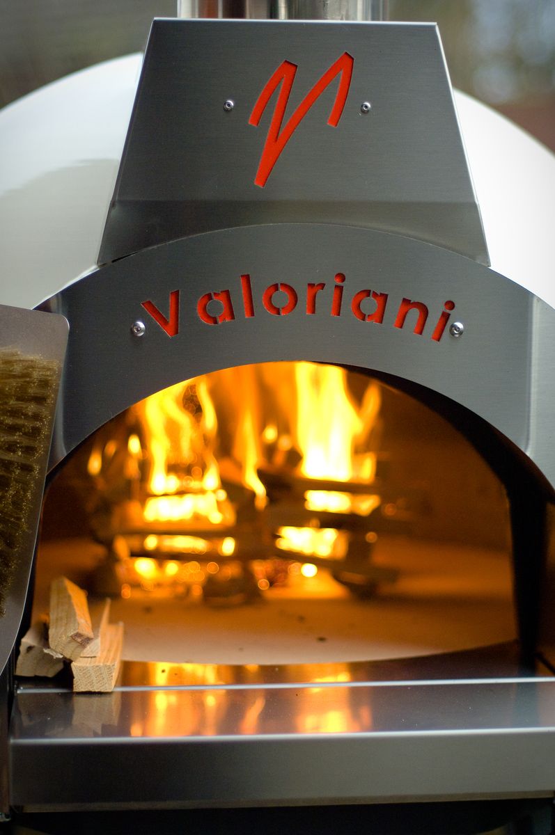 Fire burning inside a Fornino wood-fired pizza oven, supplied by Orchard Ovens in the UK and manufactured by Valoriani