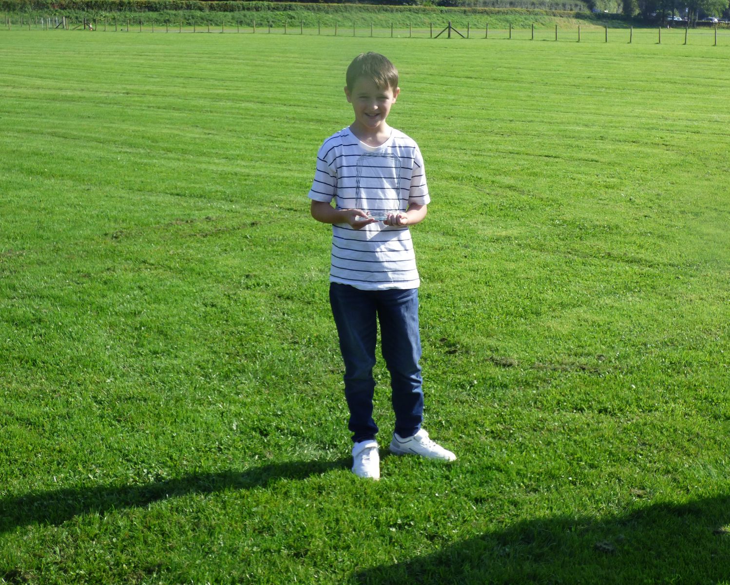 Grasmere Lakeland Sports and Show 'Young Sports Reporter 2024', Harry Taylor, with his trophy.