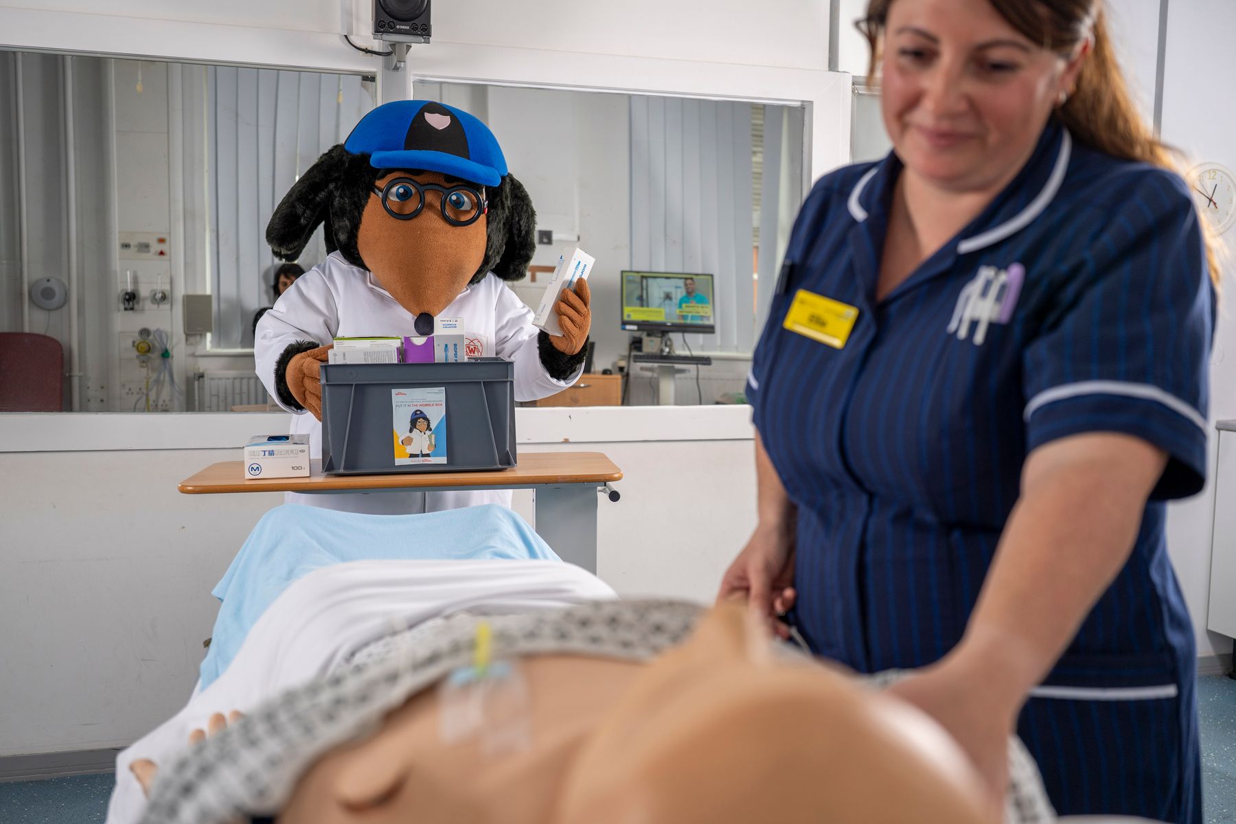 PA images - Palliative specialist care nurse Ellie Gibson with Wellington Womble.JPG