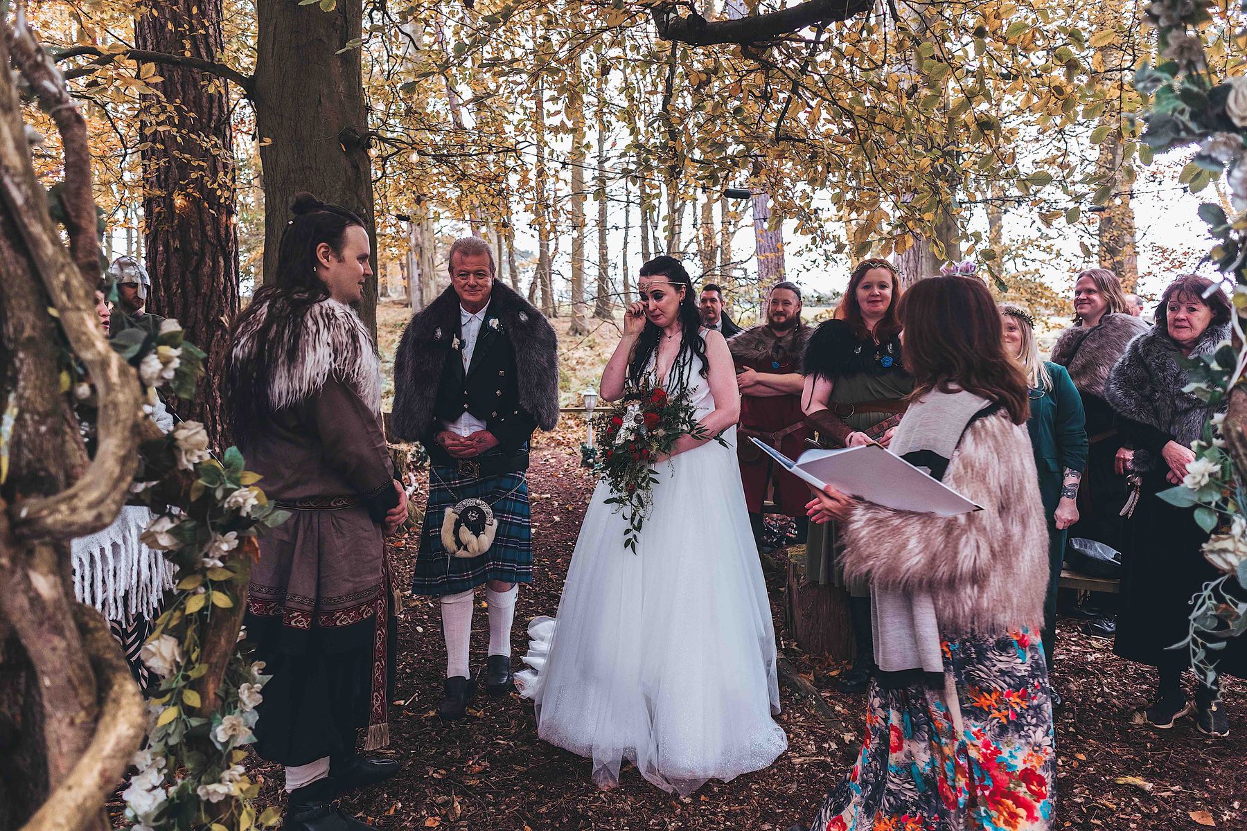 Bride arriving for Viking-themed woodland wedding at Langley Castle, Northumberland