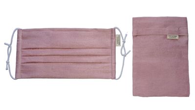 Blush pleated silk mask and matching silk pouch from Cocorose London. 