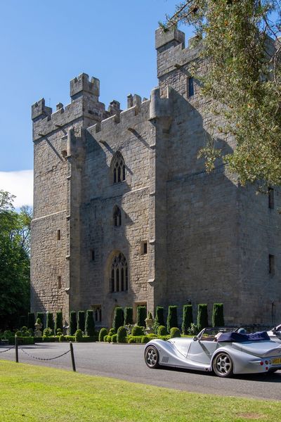 Sports car arriving at Langley Castle Hotel, Northumberland, UK