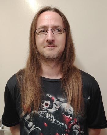Emmas husband, shaving his head to raise funds for brainstrust.JPG