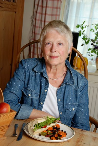 Woman seated with a salad baguette lunch