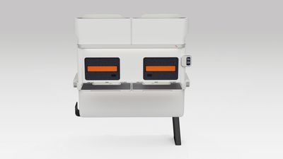 Rear view of a pair of ALIZÉ rail seats with both tables down.  